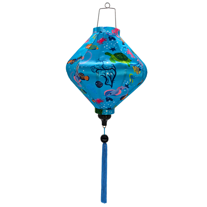 Lozenge shape Vietnamese silk lantern features a lively array of sea creatures including turtles, dolphins, clownfish, seahorses, jellyfish, and crabs. Perfect for home decor, children's rooms, this lantern brings a playful and calming marine theme to life