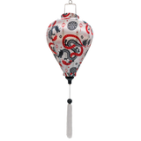 A balloon shaped lantern featuring entwined red serpentines and black dragons surrounded by lanterns, symbols, and swirls against white background.