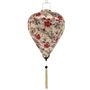 Balloon shaped silk lantern with red floral pattern on a beige background and cream tassel