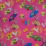 Colourful traditional pattern on a pink background with fans, flowers, and cranes.