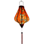 Glowing handcrafted Hoi An silk lantern featuring a bold red fabric adorned with vibrant sunflower patterns. 
