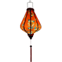 Glowing handcrafted Hoi An silk lantern featuring a bold red fabric adorned with vibrant sunflower patterns. 