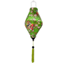 A handcrafted Hoi An silk lantern with a vibrant green fabric adorned with delicate swallows perched on a blossoming cherry tree, featuring pink and white flowers. The lantern has a unique elongated Tube shape and a matching green tassel for an elegant finish.