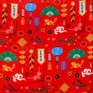 Polyester silk fabric with a print of traditional lunar new year elements like lanterns, fans, and fish on red background.
