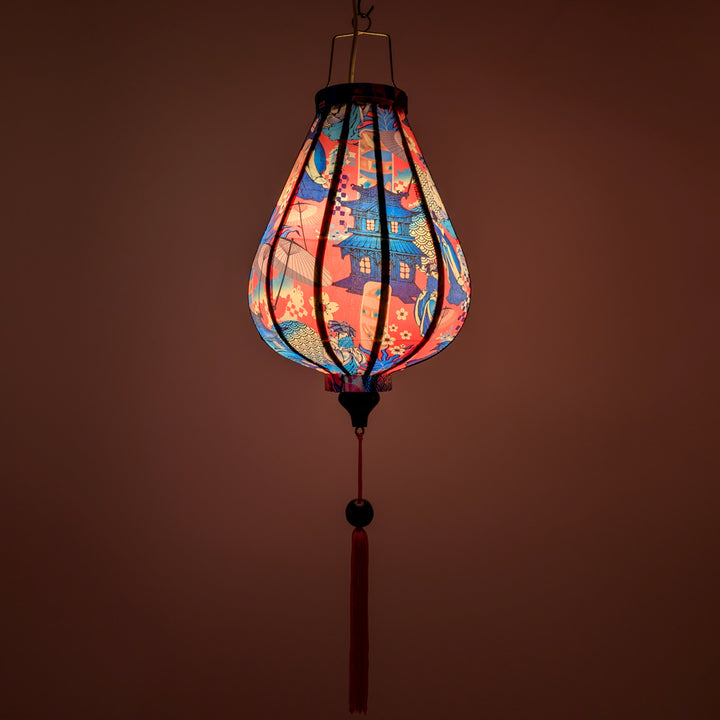 Glowing Garlic shaped silk lantern with geisha design on a pink background