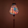 Glowing Garlic shaped silk lantern with geisha design on a pink background