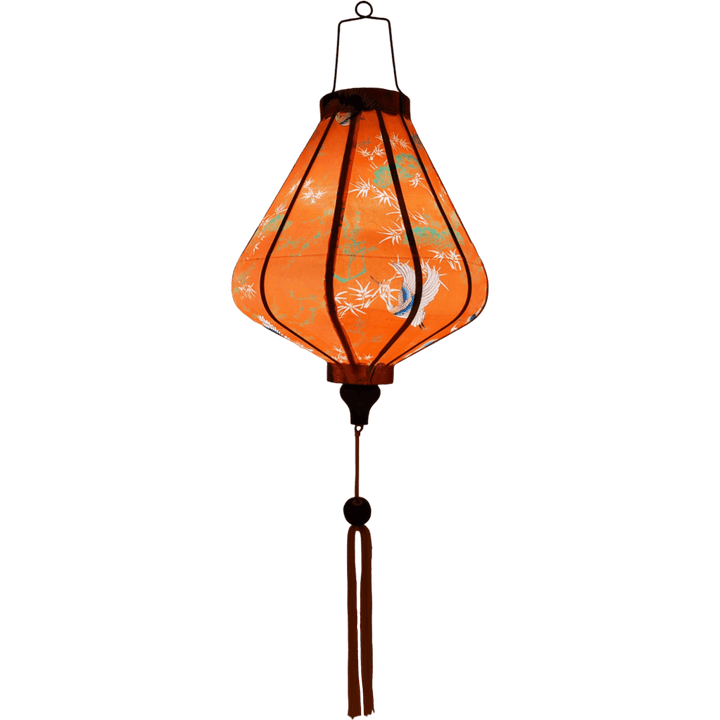 Glowinf silk lantern in warm orange, showcasing timeless Asian crane and tree motifs.