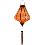 Glowinf silk lantern in warm orange, showcasing timeless Asian crane and tree motifs.