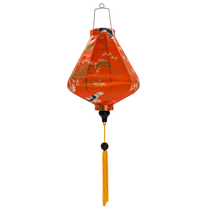Teardrop shaped traditional Hoi An lantern with graceful white cranes soaring among detailed tree designs on rich orange silk.
