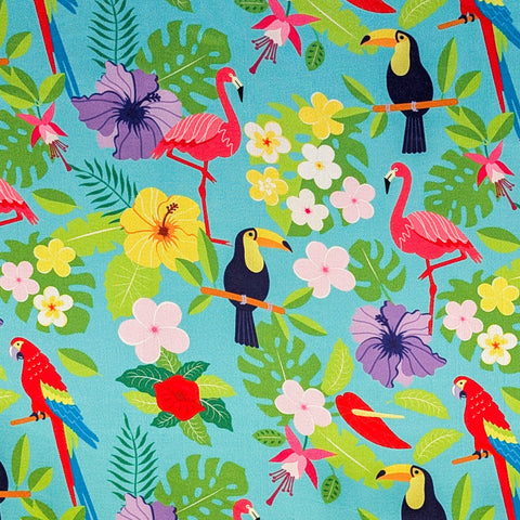 Colourful tropical print with flamingos, toucans, and parrots on a teal blue background.