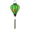 Glowing Balloon shaped lantern with green tassel featuring a print of bright bunches of flowers and various feathery avian species on a bright green backdrop.