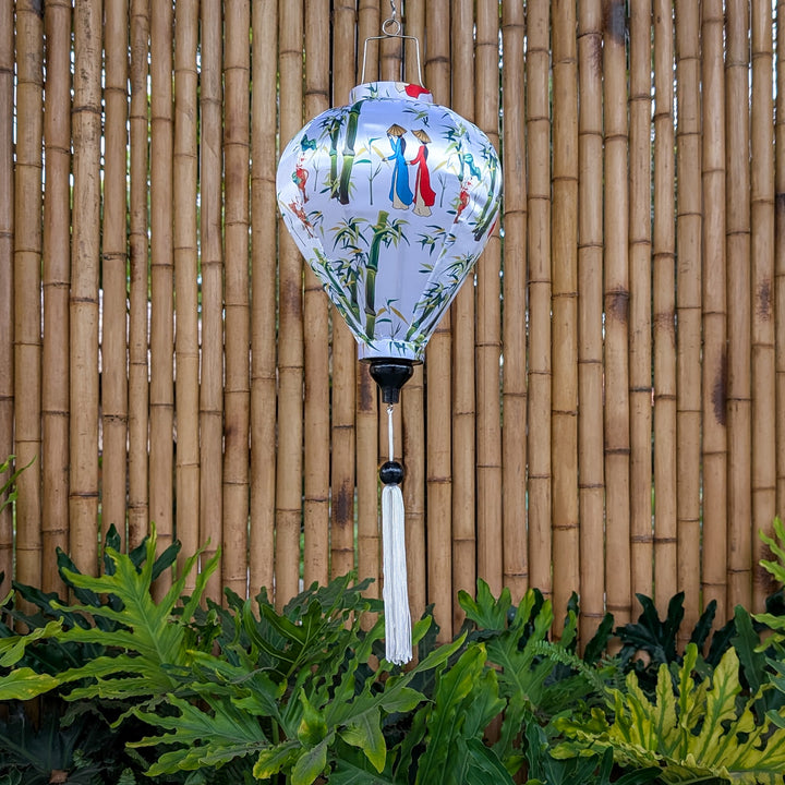 Balloon shape Vietnamese lantern with Vietnamese woman, large bamboo trees and a child riding an ox on white silk with white tassel.