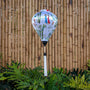 Balloon shape Vietnamese lantern with Vietnamese woman, large bamboo trees and a child riding an ox on white silk with white tassel.