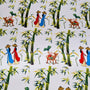 Polyester silk fabric captures the essence of traditional Vietnam with a charming countryside scene featuring women in áo dài, bamboo groves, and little boys playing an instrument while sitting on water buffalos. 