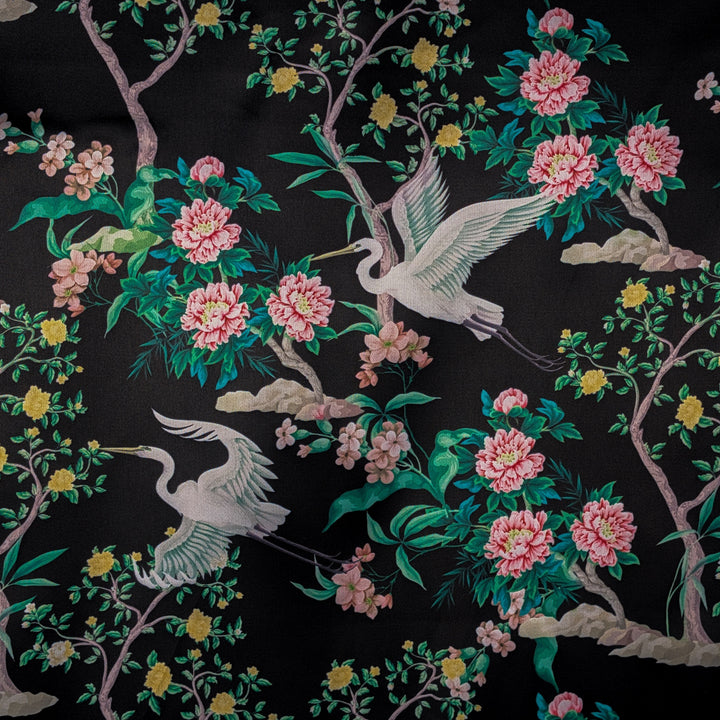 Polyester silk fabric with large white birds and flowers on a black background