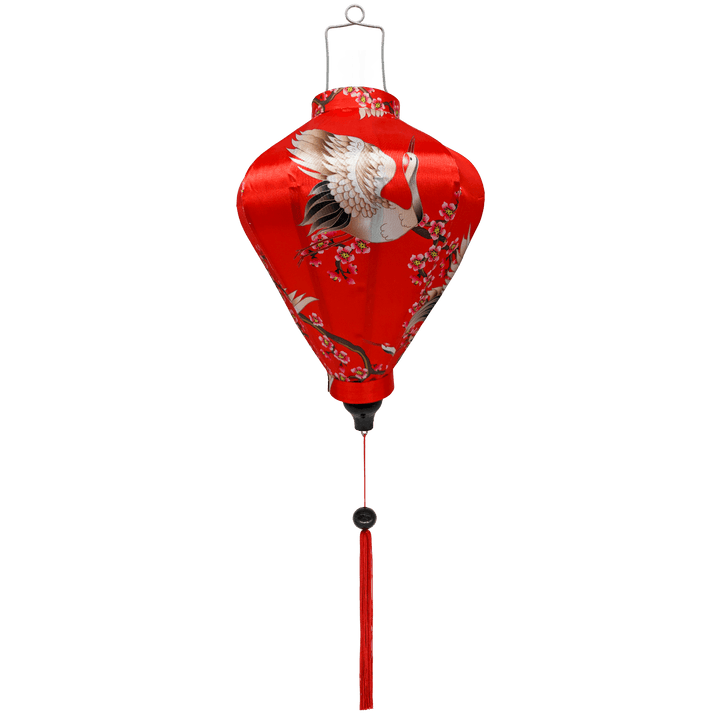 Diamond shaped Vietnamese silk lantern red-headed cranes flying and swooping around small pink and white cherry blossoms on a bold red background.