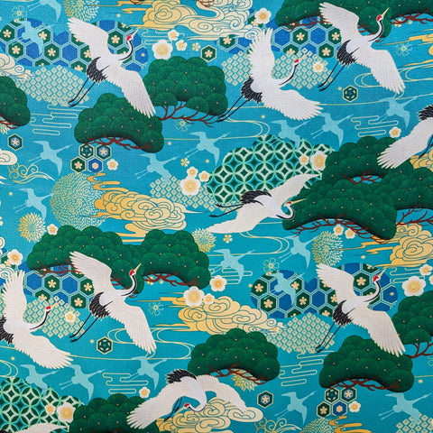 Traditional Japanese design with cranes, trees, and geometric patterns on a teal blue background