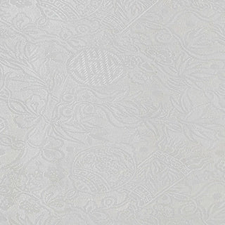 Close up of white jacquard silk fabric with intricate patterns of bamboo, lanterns and symbols.