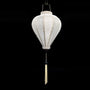 A Hoi An silk lantern in a balloon shape, crafted from luxurious white jacquard fabric with intricate floral patterns woven into the material. This lantern features a black wooden base, a metal hanging hook, and a delicate ivory tassel, making it a timeless decorative piece for homes, events, or special celebrations.