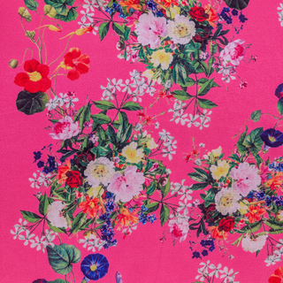 Polyester silk fabric with bouquet of colourful floral patterns on a pink background
