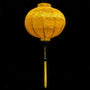 A stunning Hoi An silk lantern in a vibrant yellow hue, adorned with intricate jacquard patterns featuring traditional motifs.