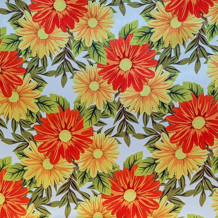 Pattern of orange and yellow flowers with green leaves on a white background