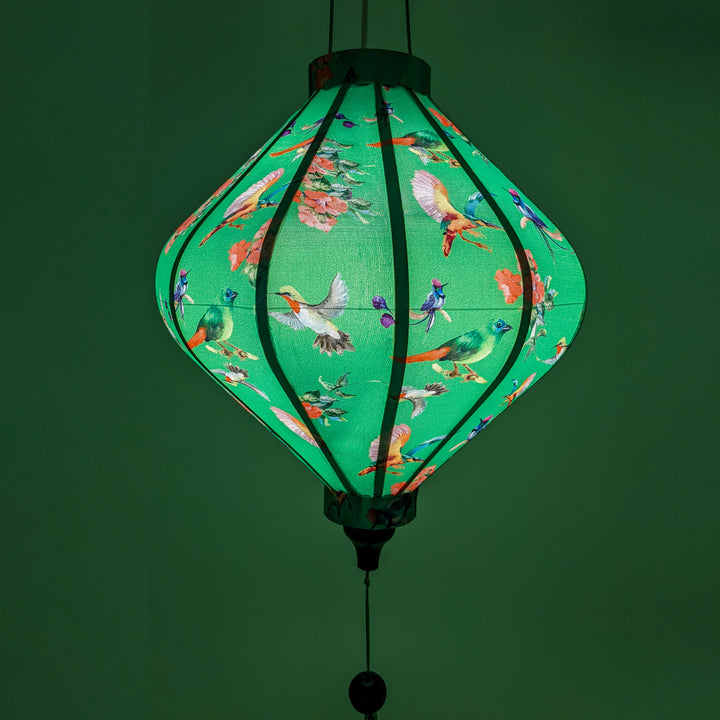 Lozenge Vietnamese lantern lit from inside creating a glowing green hue!