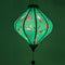 Lozenge Vietnamese lantern lit from inside creating a glowing green hue!