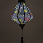 Up close glowing Teardrop shaped Vietnamese Hoi An lantern.