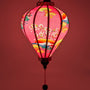 Glowing soft pink silk lantern, handmade in Hoi An, perfect for weddings, home decor, and cozy lighting.