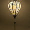 Glowing Balloon shape Vietnamese silk lantern with white fabric and blue bonsai tree print.