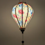 balloon shaped glowing lantern with graceful cranes, vibrant chrysanthemums, and delicate dragonflies