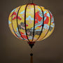 Glowing lantern with traditional design on a yellow background