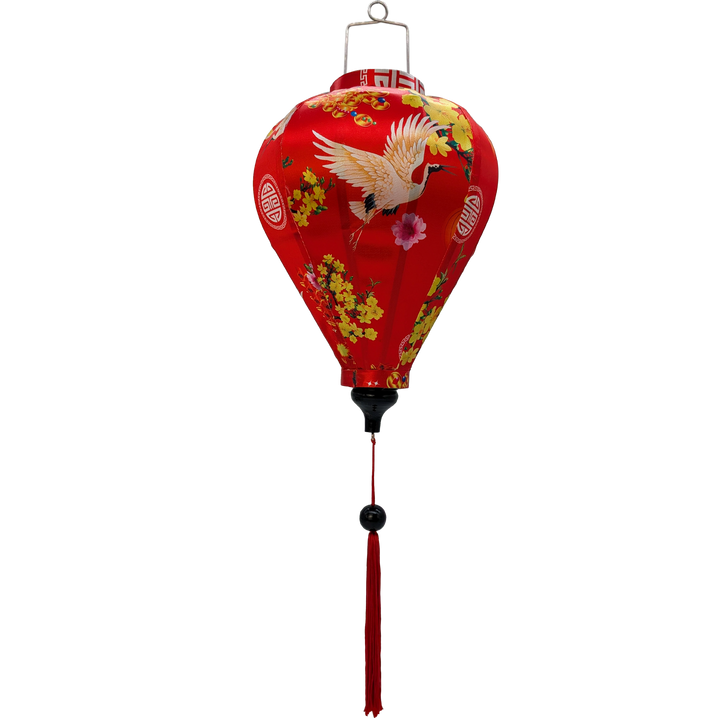 balloon shaped Vietnamese lantern with red headed cranes in flight, pink and yellow flowers, firecrackers and orange lanterns print and red tassel