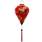 A balloon shaped Vietnamese lantern with red headed cranes in flight, pink and yellow flowers, firecrackers and orange lanterns print and red tassel.