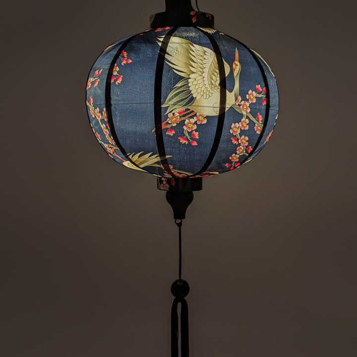 Glowing round shaped Vietnamese Hoi An lantern ideal for Asian-inspired home decor and cozy lighting.