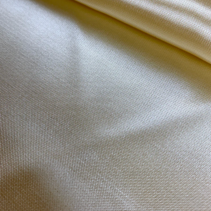 Plain Cream Polyester silk fabric used to create handmade Vietnamese silk lanterns in Hoi An, Vietnam.
