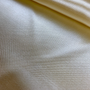 Plain Cream Polyester silk fabric used to create handmade Vietnamese silk lanterns in Hoi An, Vietnam.