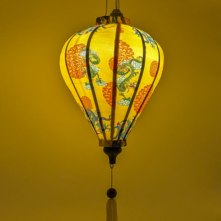 Glowing lantern with dragon design on a yellow background