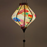 Up close Lozenge shaped glowing Vietnamese Lantern.