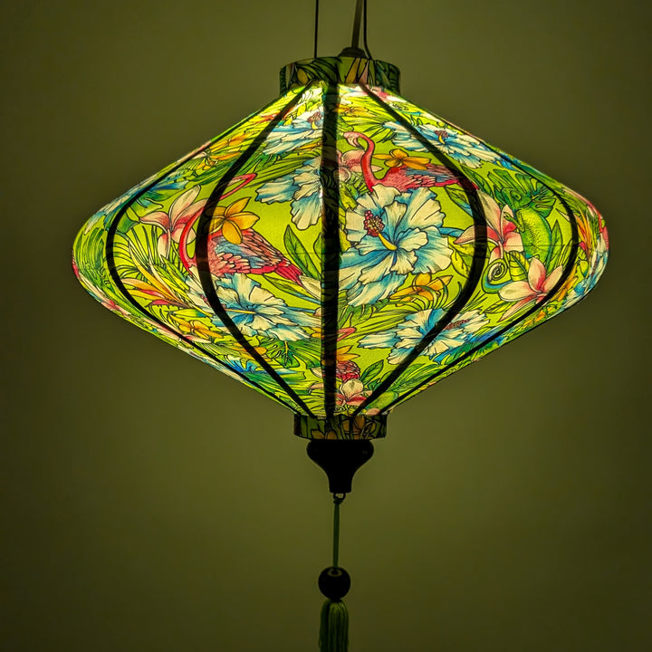 Glowing floral patterned lantern with flamingos and chameleons on a green background