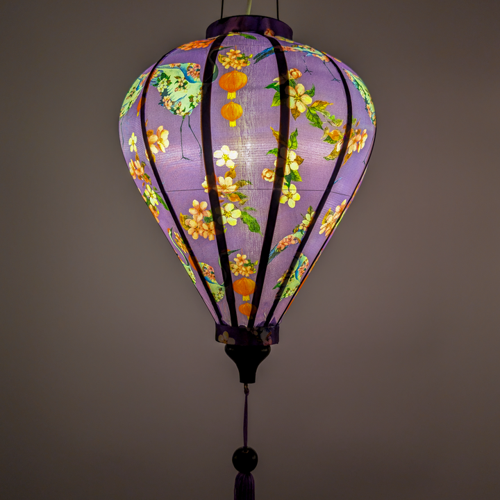 Purple lantern with floral patterns on a purple background