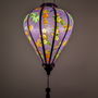 Purple lantern with floral patterns on a purple background
