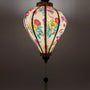 Up close of a glowing lantern with a light placed inside creating a soft warm glow.