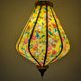Teardrop shape lantern with floral pattern creating a gorgeous yellow glow 