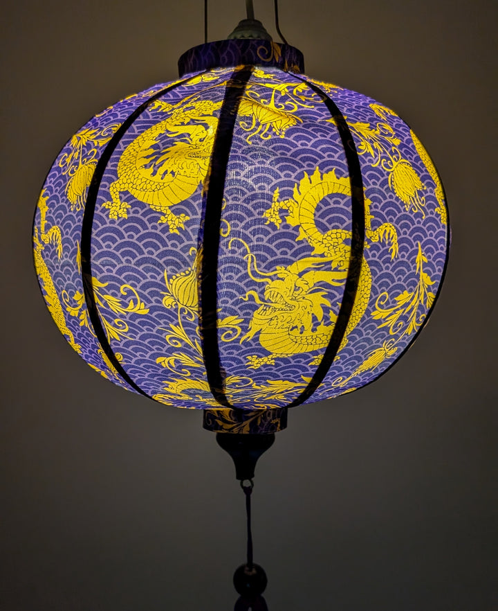 Glowing lantern lit from within featuring yellow golden dragons on a purple background