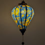 Decorative lamp with blue and yellow dragon design on a dark background