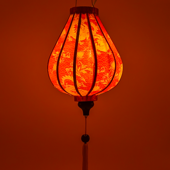 Glowing lantern with intricate design on an orange background