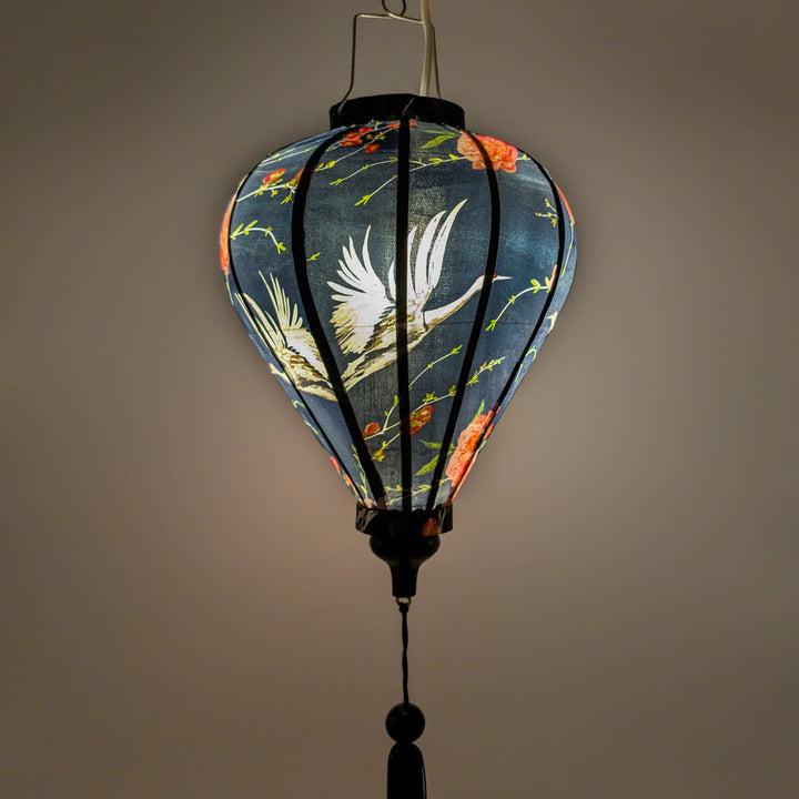 A balloon shaped lantern with light bulb inside creating a beautiful soft glow.