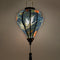 A balloon shaped lantern with light bulb inside creating a beautiful soft glow.